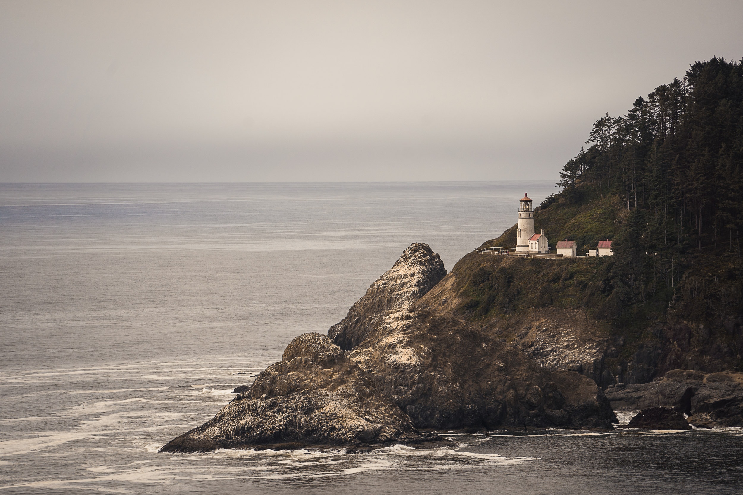 heceta head lighthouse from a viewpoint on highway 101 - best stops on the oregon coast