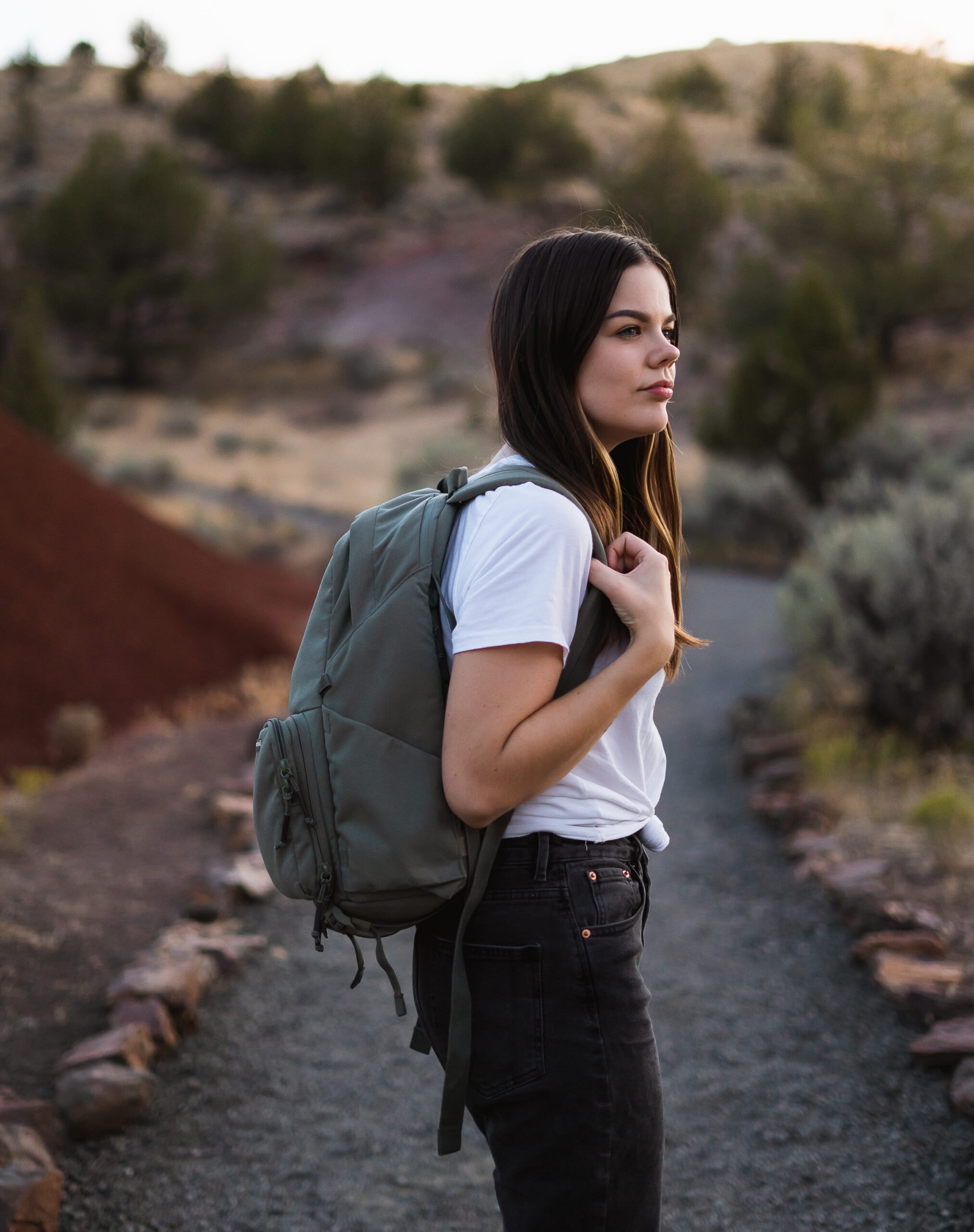why are people obsessed with travelling? to explore and go on adventures! Girl portrait in painted hills oregon