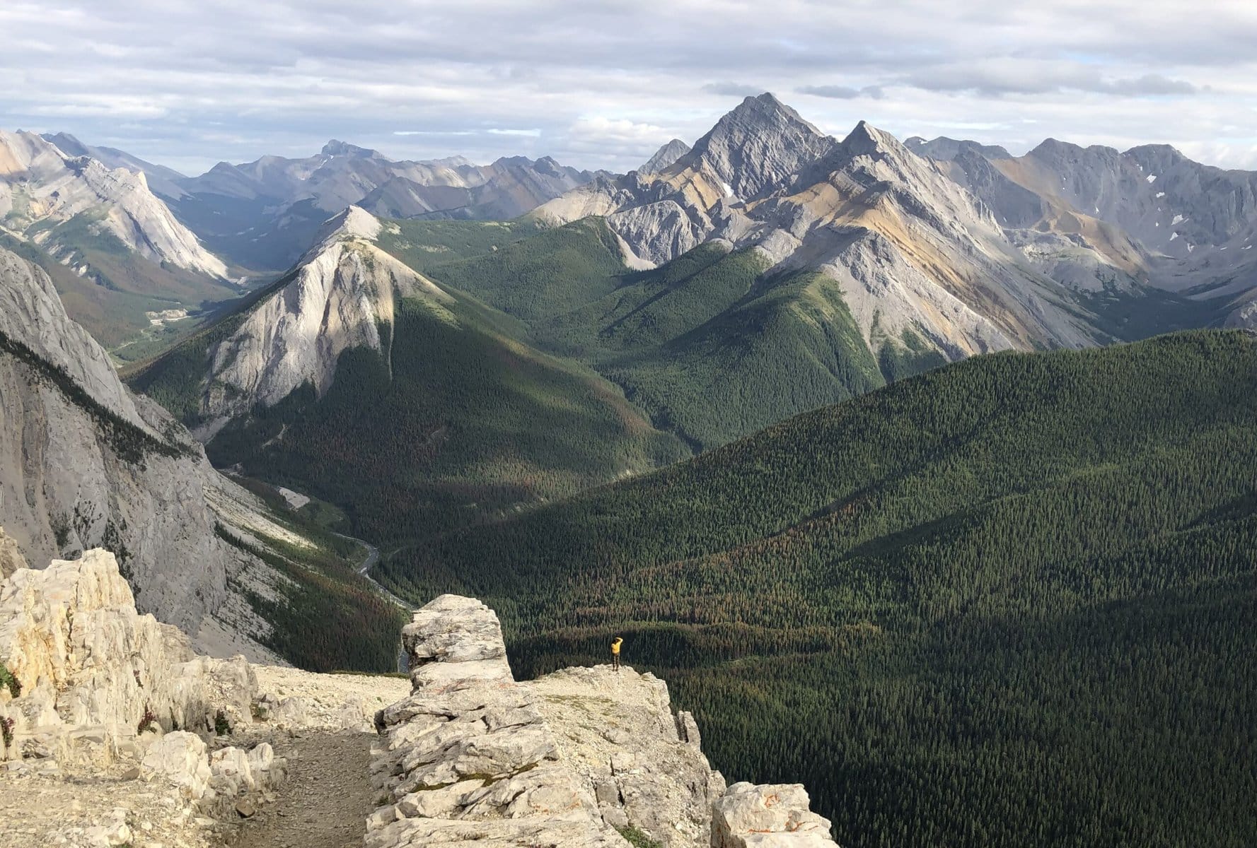 shot on the iphone. a view of the mountains and a tiny person to show how small this place makes you really feel when you summit sulphur skyline trail. one of the best hikes in jasper national park
