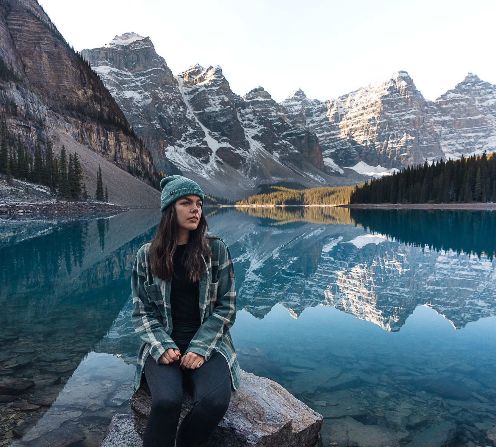 sitting at moraine lake in the morning during the fall season